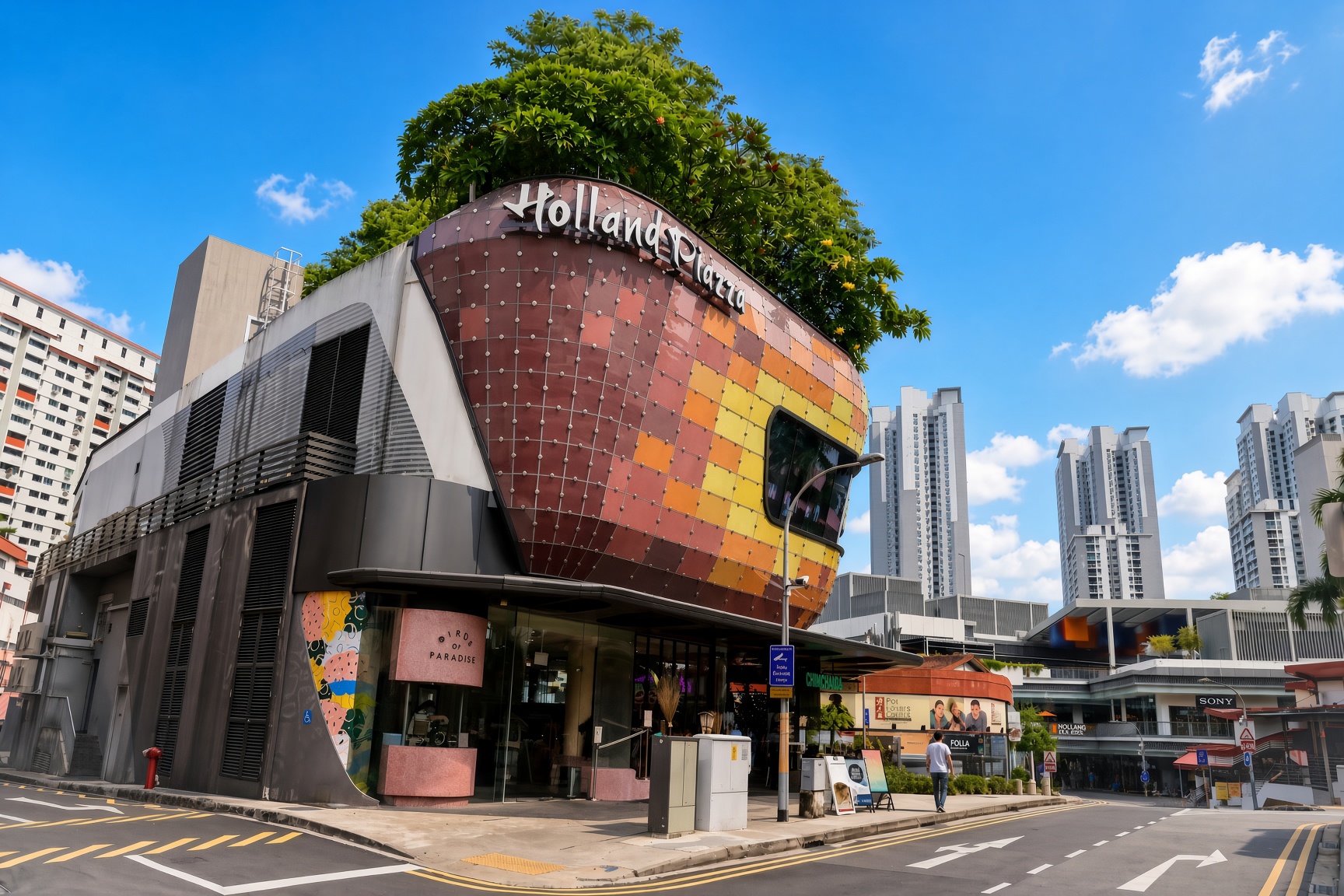 Holland Piazza in Holland Village, Singapore, surrounded by shops and residential buildings.