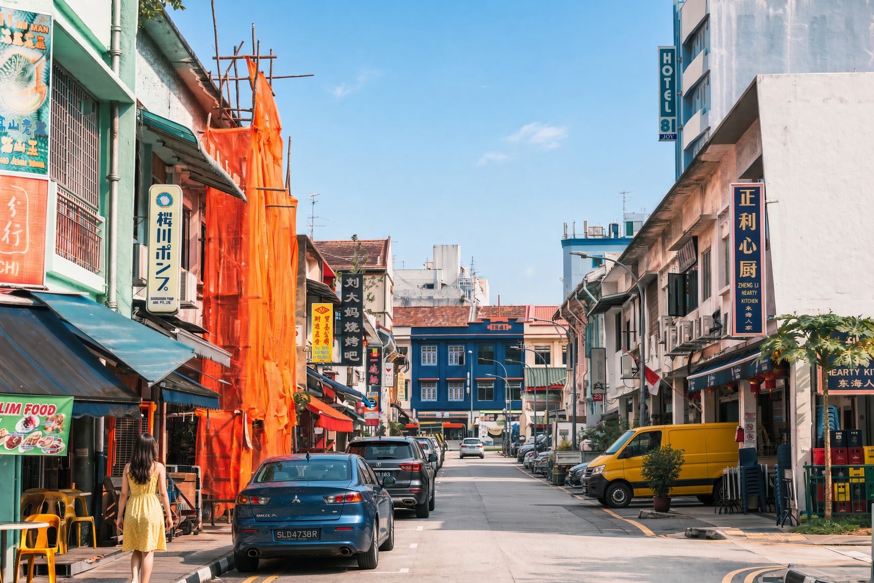 Traditional shophouses and local businesses along a street in Geylang, Singapore.